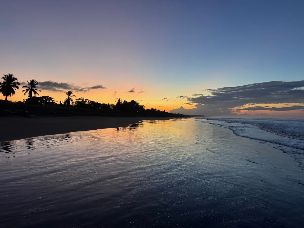 Blue-hour light and a golden horizon over Playa Hermosa