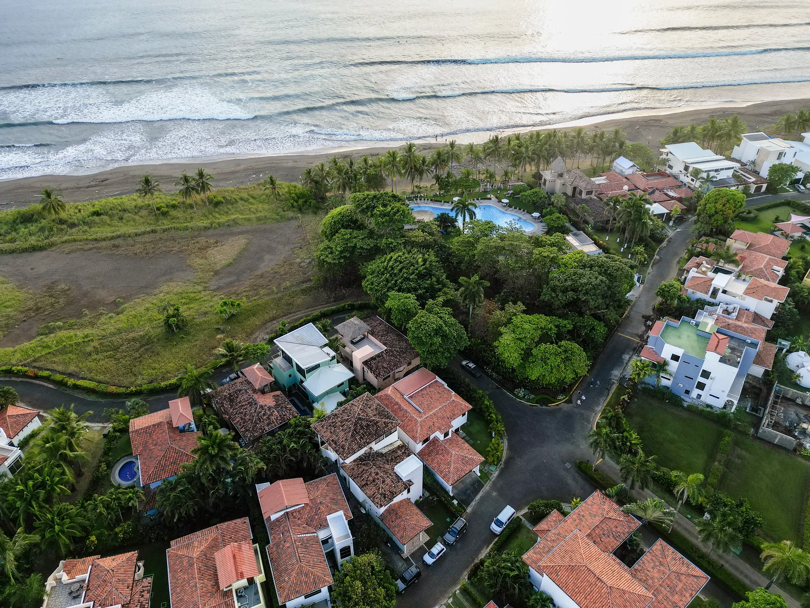 Aerial view of Hermosa Palms homes, the Beach Club pool and the Playa Hermosa shoreline