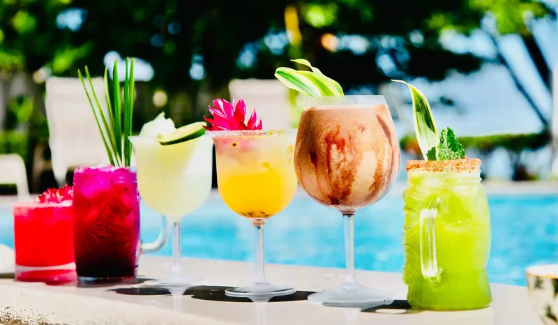 Colorful tropical cocktails served poolside at YoYo's